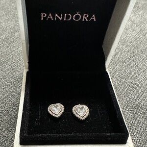 Pandora Heart shaped earrings with large stone in the middle pave surrounding
